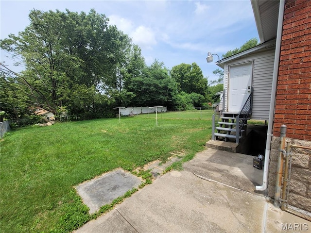 2965 Kincaid Ave, St John, MO 63114 - view of green lawn featuring entry steps