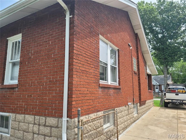 2965 Kincaid Ave, St John, MO 63114 - view of side of property featuring brick siding