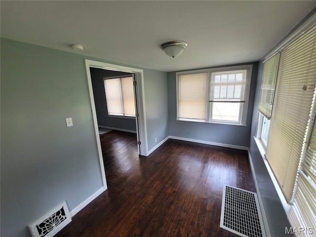 2965 Kincaid Ave, St John, MO 63114 - spare room with wood finished floors and a smoke detector