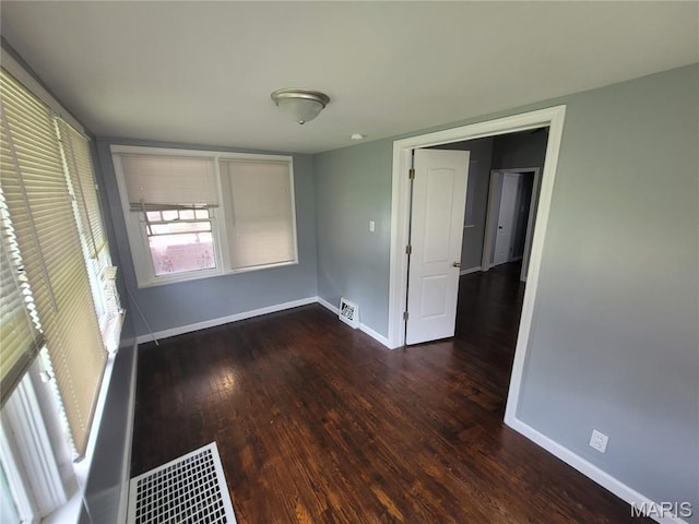 2965 Kincaid Ave, St John, MO 63114 - unfurnished room featuring baseboards and wood finished floors
