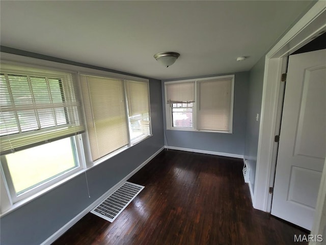 2965 Kincaid Ave, St John, MO 63114 - unfurnished room featuring baseboards and wood finished floors