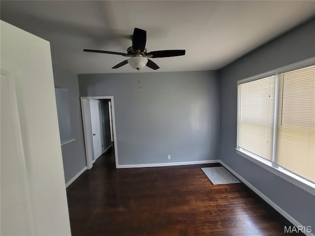 2965 Kincaid Ave, St John, MO 63114 - spare room featuring dark wood finished floors and ceiling fan