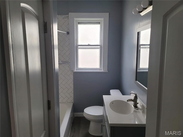 2965 Kincaid Ave, St John, MO 63114 - bathroom featuring vanity, plenty of natural light, and washtub / shower combination
