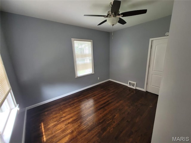 2965 Kincaid Ave, St John, MO 63114 - unfurnished room with a ceiling fan and dark wood-style flooring