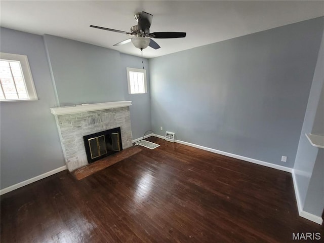 2965 Kincaid Ave, St John, MO 63114 - unfurnished living room with a fireplace, ceiling fan, and wood finished floors