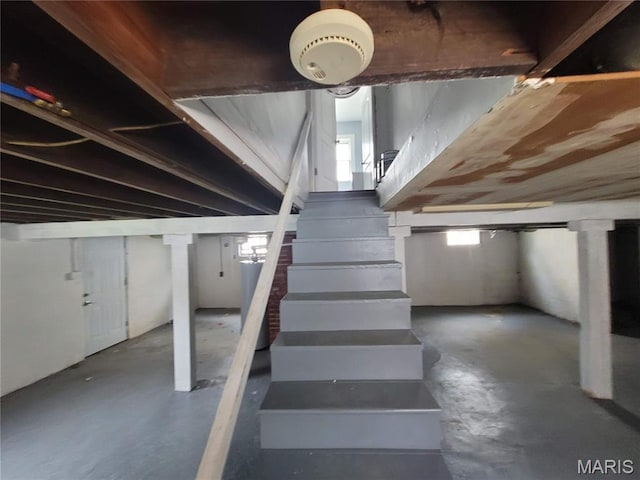 2965 Kincaid Ave, St John, MO 63114 - stairway featuring concrete floors and plenty of natural light