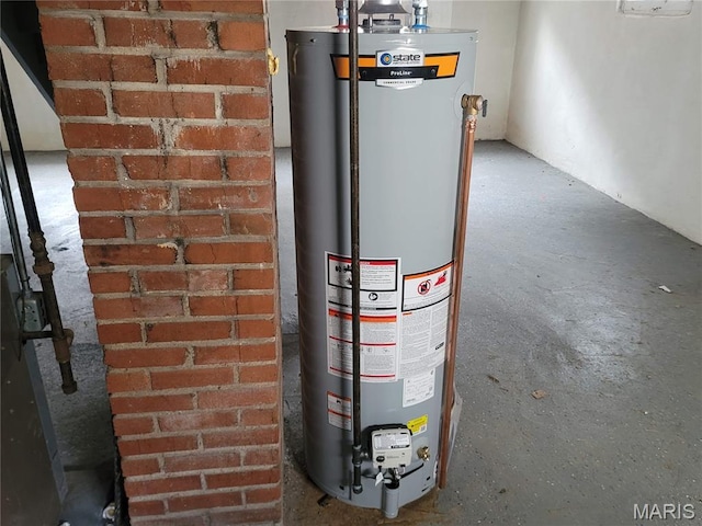 2965 Kincaid Ave, St John, MO 63114 - utility room featuring water heater