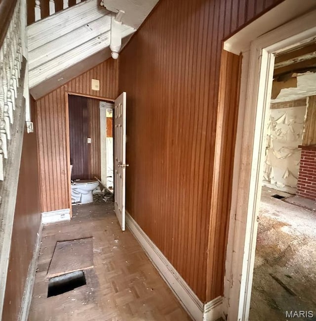 4017 Maffitt Ave, Saint Louis, MO 63113 - corridor featuring lofted ceiling and wooden walls