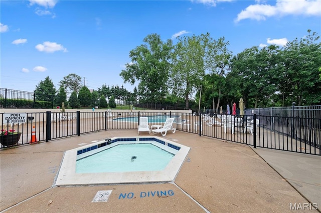 12107 Autumn Lakes Dr, Maryland Heights, MO 63043 - community pool featuring a patio and a community hot tub