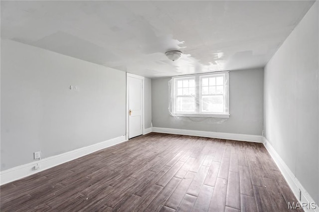 5746 Acme, Jennings, MO 63136 - spare room with dark wood finished floors and baseboards