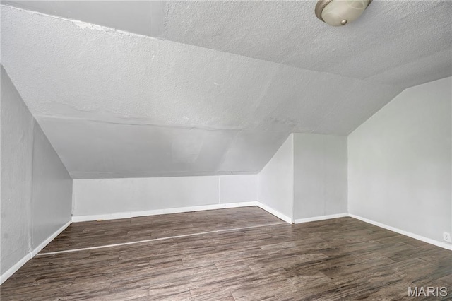 5746 Acme, Jennings, MO 63136 - bonus room with a textured ceiling, vaulted ceiling, and wood finished floors