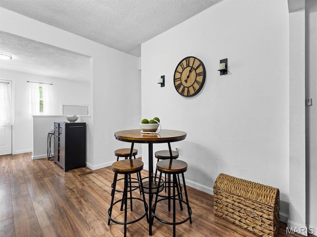 414 Plum St, Edwardsville, IL 62025 - dining room featuring wood finished floors and a textured ceiling