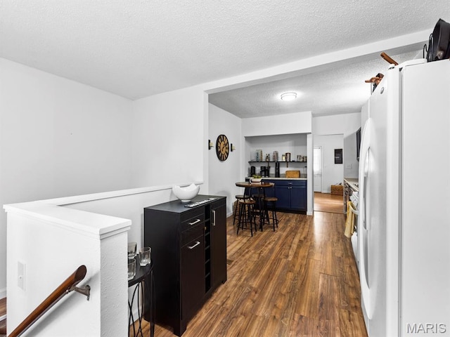 414 Plum St, Edwardsville, IL 62025 - kitchen with freestanding refrigerator and dark wood-style flooring