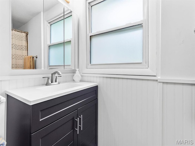 414 Plum St, Edwardsville, IL 62025 - full bathroom with vanity and wainscoting