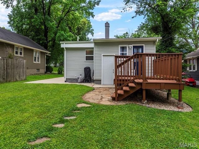 414 Plum St, Edwardsville, IL 62025 - back of property featuring a chimney, a deck, and a patio area