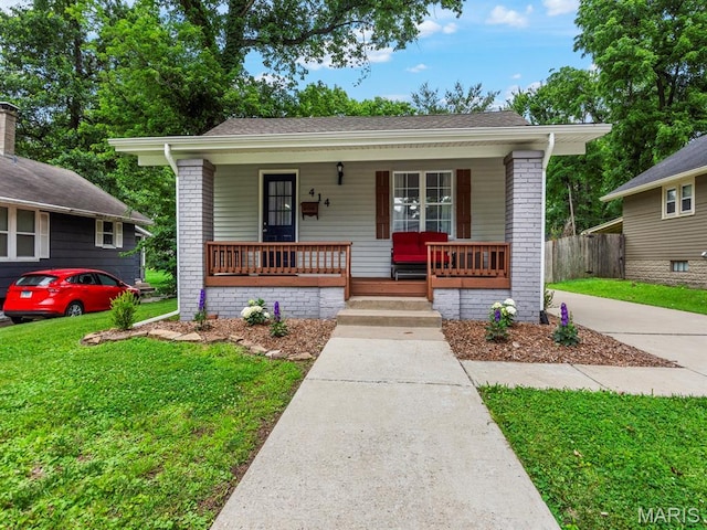 414 Plum St, Edwardsville, IL 62025 - bungalow-style house featuring a porch and brick siding