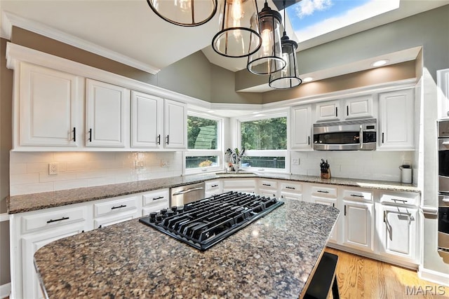 3 Morganfield Ct, Chesterfield, MO 63005 - kitchen featuring appliances with stainless steel finishes, white cabinets, a chandelier, a kitchen island, and recessed lighting