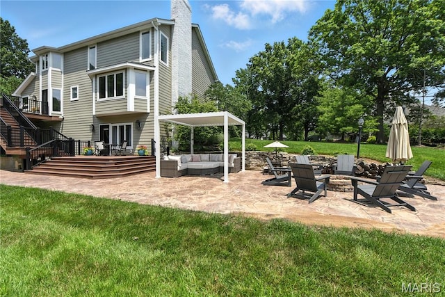 3 Morganfield Ct, Chesterfield, MO 63005 - back of house featuring a patio area, an outdoor living space with a fire pit, a chimney, and a yard