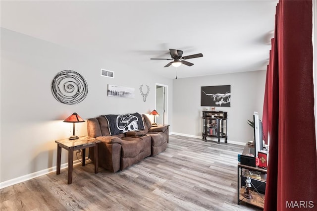 1140 Lindsay Ln, Florissant, MO 63031 - living area featuring ceiling fan and light wood-type flooring