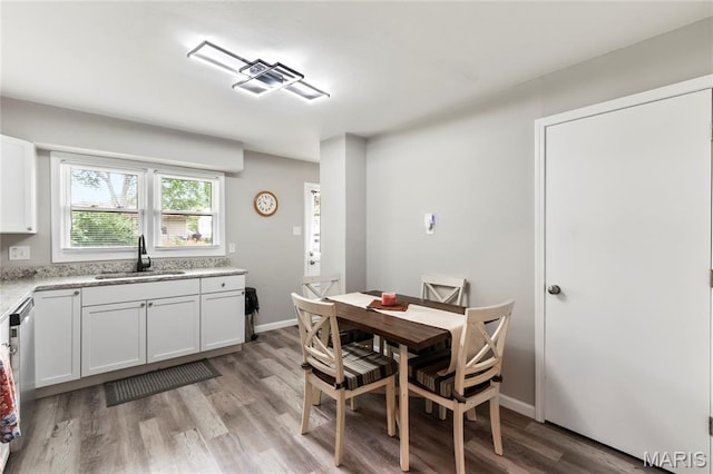 1140 Lindsay Ln, Florissant, MO 63031 - dining space with light wood finished floors