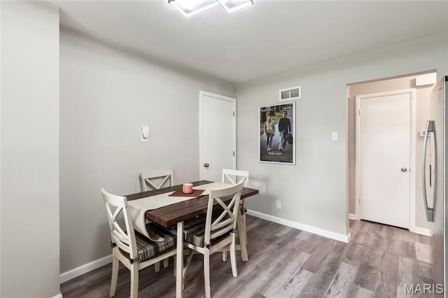 1140 Lindsay Ln, Florissant, MO 63031 - dining room featuring wood finished floors and baseboards