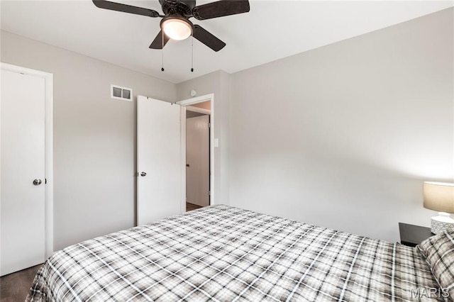 1140 Lindsay Ln, Florissant, MO 63031 - bedroom with wood finished floors and a ceiling fan