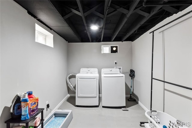 1140 Lindsay Ln, Florissant, MO 63031 - washroom with baseboards and washing machine and dryer