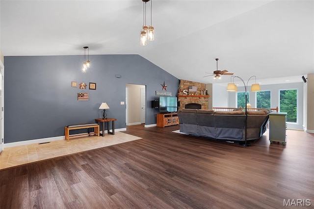 6232 Clover Lake Dr, Cedar Hill, MO 63016 - living area featuring wood finished floors, ceiling fan, vaulted ceiling, and a stone fireplace