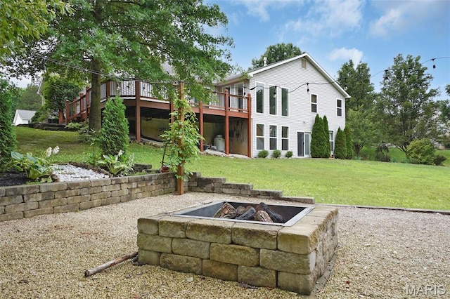 6232 Clover Lake Dr, Cedar Hill, MO 63016 - rear view of house with an outdoor fire pit, a deck, and a lawn
