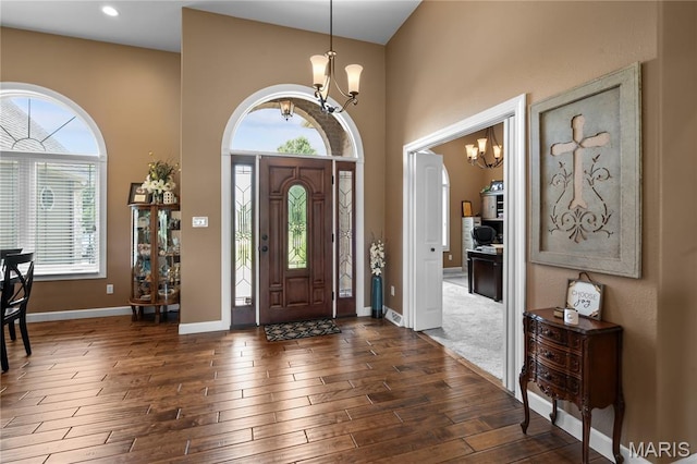 108 Jennings Ln, Sikeston, MO 63801 - entryway featuring a chandelier, dark wood-style floors, and a high ceiling