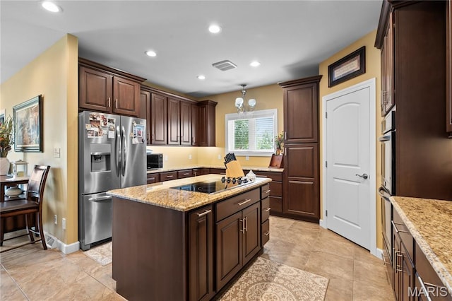 108 Jennings Ln, Sikeston, MO 63801 - kitchen featuring stainless steel fridge with ice dispenser, black electric stovetop, a kitchen island, dark brown cabinetry, and light stone counters