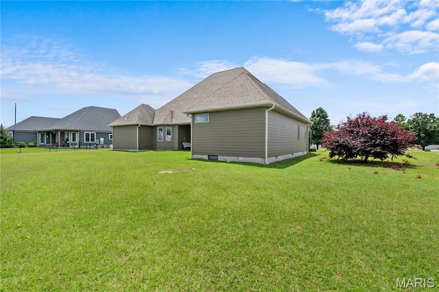 108 Jennings Ln, Sikeston, MO 63801 - rear view of property featuring a yard