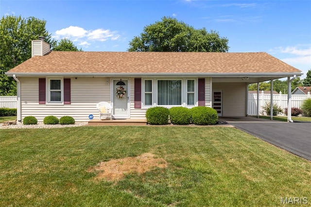 111 Freedom Dr, Belleville, IL 62226 - ranch-style house with a carport, a chimney, driveway, and a shingled roof