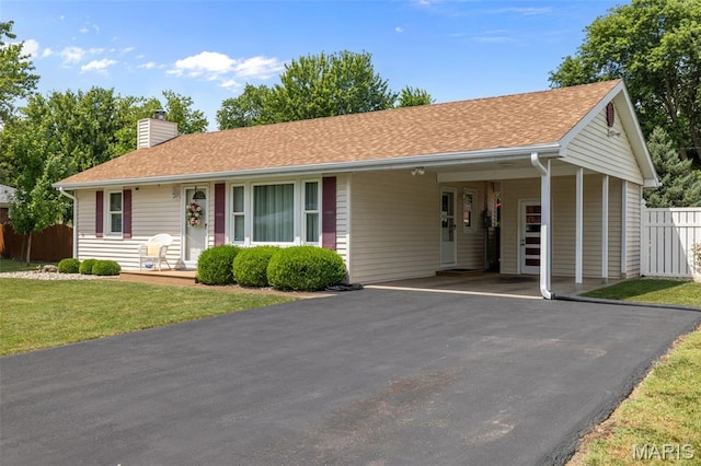 111 Freedom Dr, Belleville, IL 62226 - ranch-style house with asphalt driveway, a carport, a chimney, and roof with shingles