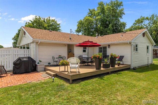 111 Freedom Dr, Belleville, IL 62226 - rear view of house with a wooden deck, roof with shingles, and outdoor dining area