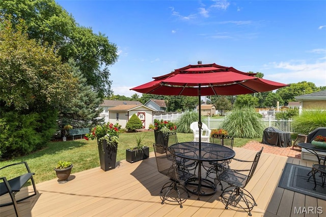 111 Freedom Dr, Belleville, IL 62226 - wooden deck featuring outdoor dining space and an outbuilding