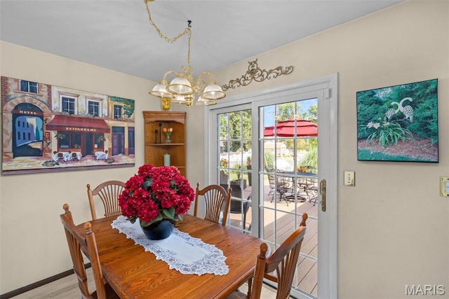 111 Freedom Dr, Belleville, IL 62226 - dining space featuring a chandelier and baseboards