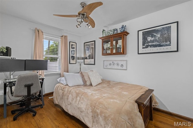 111 Freedom Dr, Belleville, IL 62226 - bedroom with wood finished floors, a desk, and a ceiling fan
