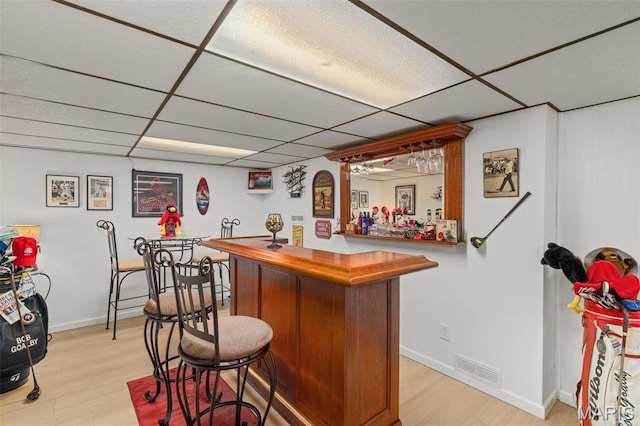 111 Freedom Dr, Belleville, IL 62226 - indoor dry bar featuring a paneled ceiling and light wood-style floors