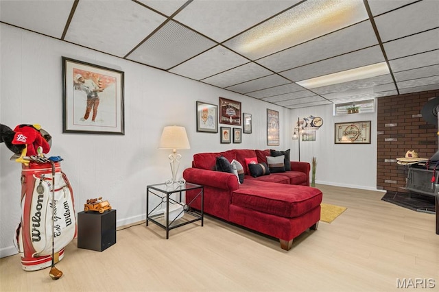 111 Freedom Dr, Belleville, IL 62226 - living room featuring a wood stove, wood finished floors, and a drop ceiling