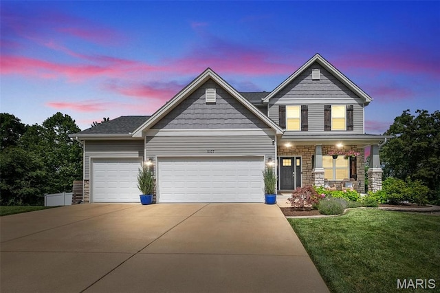 5107 Ruddy Ridge Ct, High Ridge, MO 63049 - view of front of house with concrete driveway, a garage, a porch, a front yard, and stone siding