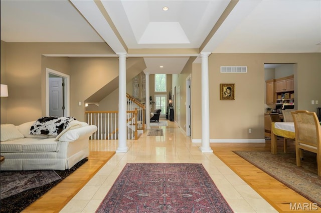 1001 Laurel Bend Ct S, Kirkwood, MO 63122 - foyer with decorative columns, light tile patterned floors, stairs, and recessed lighting