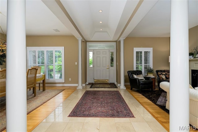 1001 Laurel Bend Ct S, Kirkwood, MO 63122 - foyer entrance featuring ornate columns, tile patterned flooring, recessed lighting, and a raised ceiling