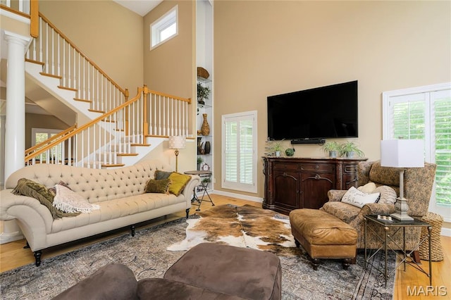1001 Laurel Bend Ct S, Kirkwood, MO 63122 - living room with a high ceiling, wood finished floors, and stairway