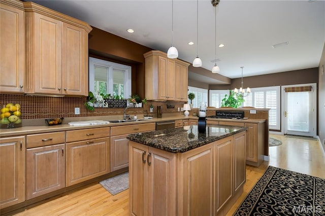 1001 Laurel Bend Ct S, Kirkwood, MO 63122 - kitchen featuring a kitchen island, light wood-style floors, a peninsula, tasteful backsplash, and recessed lighting