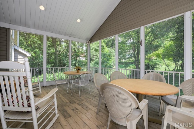 1001 Laurel Bend Ct S, Kirkwood, MO 63122 - sunroom with outdoor dining space, lofted ceiling, and view of wooded area