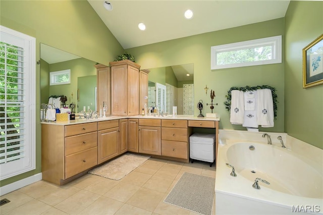 1001 Laurel Bend Ct S, Kirkwood, MO 63122 - bathroom featuring vaulted ceiling, a garden tub, vanity, tile patterned flooring, and healthy amount of natural light