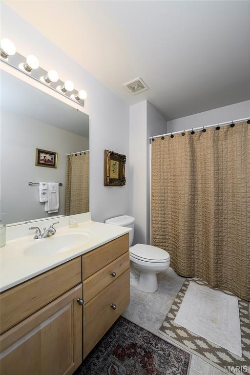 1001 Laurel Bend Ct S, Kirkwood, MO 63122 - bathroom with vanity and tile patterned flooring