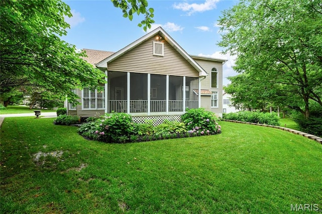 1001 Laurel Bend Ct S, Kirkwood, MO 63122 - rear view of property with a lawn and a sunroom