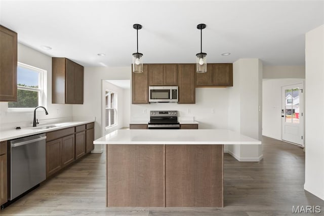 510 Founders Way, Foristell, MO 63348 - kitchen featuring appliances with stainless steel finishes, light wood-type flooring, a kitchen island, light countertops, and recessed lighting